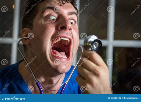 Crazy Nurse Giving Injection To Scared Man Royalty Free Stock