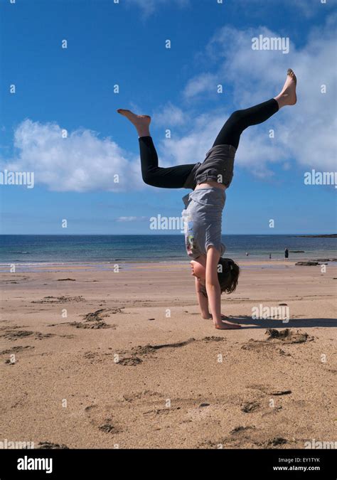Girl Doing Handstand On A Beach Stock Photo Alamy