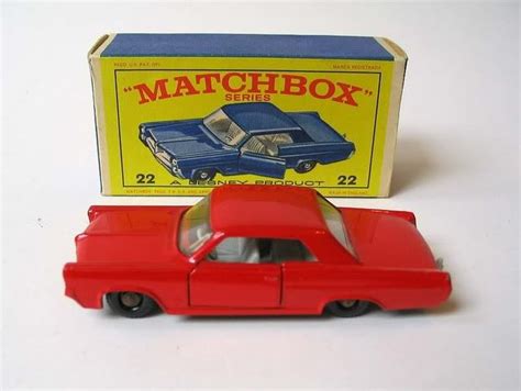 An Old Matchbox Toy Car With Its Box Open