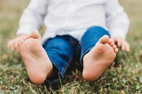 Barebood Baby Feet On A Grass Healthy Walk Development Stock Photo