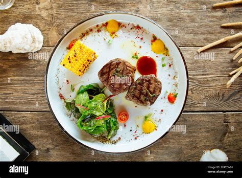 Grilled Fillet Mignon Steaks With Corn And Salad Stock Photo Alamy