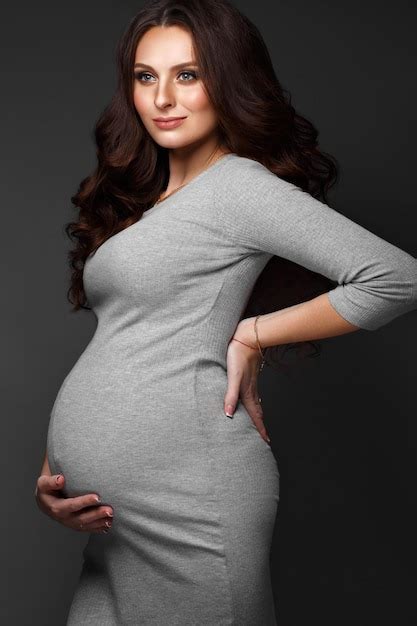 Premium Photo Beautiful Pregnant Woman In A Gray Dress With A Classic