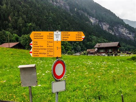 Signpost Written In German Tells Various Hiking Trail Directions