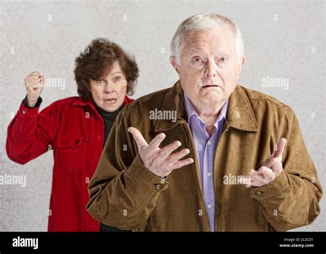 Confused Elderly Man With Angry Older Woman Stock Photo Alamy