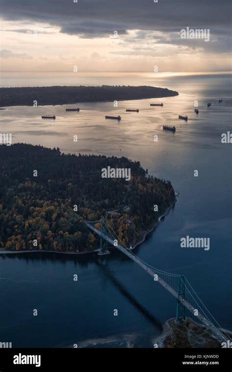 Aerial View Of Lions Gate Bridge And Stanley Park During A Stormy Cloud