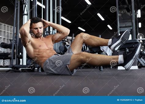 Sporty Man Stretching And Warm Up Doing Special Exercises For Muscles