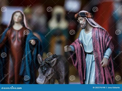 Nativity Scene With Joseph Figure Next To Donkey And Mother Mary