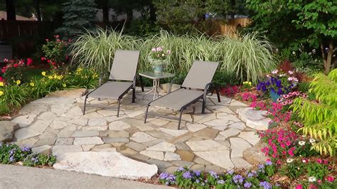 Natural Flagstone Patio Surrounded By Variegated Miscanthus Grass