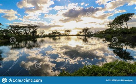A Scenic Lake At The Foot Of Mount Isarog Reflecting The Sky In The
