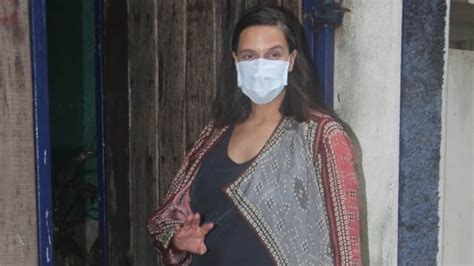 in pics pregnant neha dhupia is simply chic in comfy dress and printed