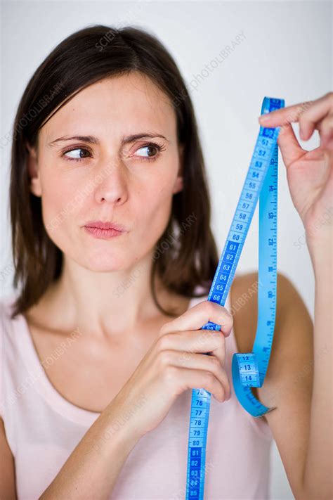 Woman With Measuring Tape Stock Image C Science Photo Library