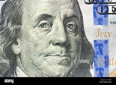 Close Up Of Benjamin Franklin Face On 100 Us Dollar Bill Stock Photo