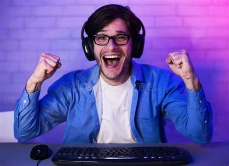 Professional Gamer Playing And Winning Shooter Online Game Stock Photo