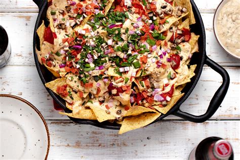 Tangy sauce drizzled on crispy dough crust chips, topped with pepperoni and melted cheese. Vegan Pizza Nachos (Dairy-Free, Meat-Free) | Two Market Girls
