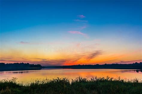 Lakeside Sunset Reflection At Twilight Stock Photo Image Of Water