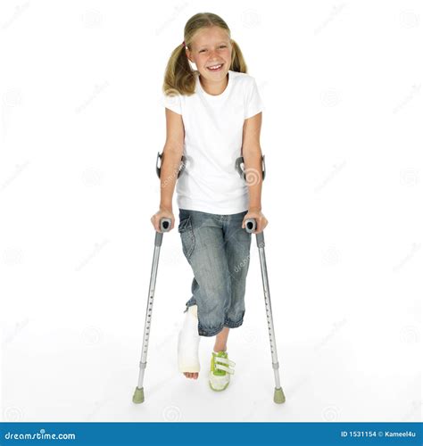 Girl With A Broken Leg Walking On Crutches Stock Photography