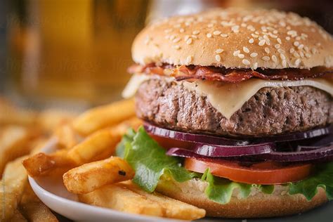 Hamburger With French Fries By Stocksy Contributor Davide Illini