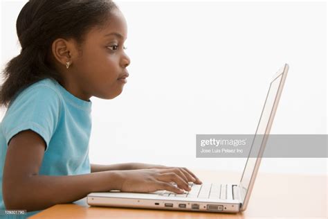 Black Girl Typing On Laptop High Res Stock Photo Getty Images