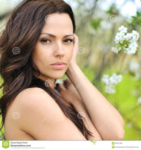Closeup Portrait Of Young Beautiful Woman On The Nature