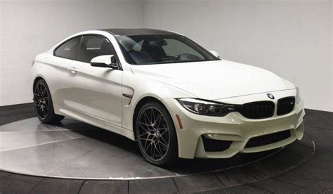 This is a very nicely spec'd bmw m4 with mineral white metallic exterior paint and cloth/leather carbonstructure interior, competition package, executive package, 20 m wheels, park distance control, heads up display, and heads up display. Used 2018 BMW M4 Competition Package For Sale ($59,900) | Brickell Luxury Motors Stock #BAG62932P