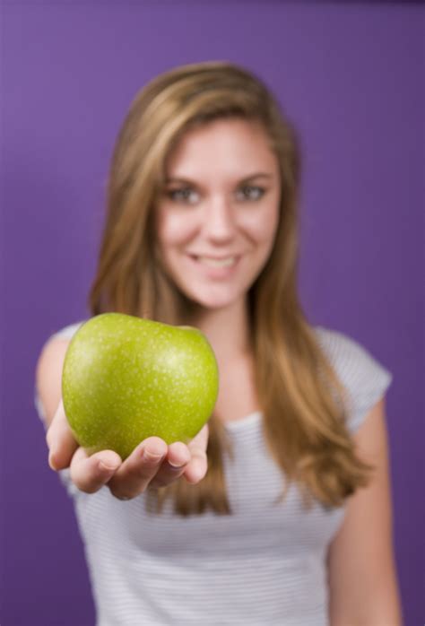 Apples Free Stock Photo A Young Woman Holding A Green Apple 16085