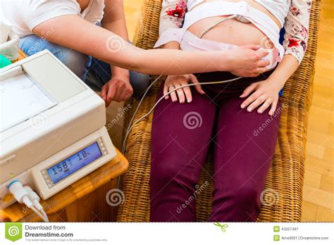 Midwife Seeing Mother For Pregnancy Examination Stock Image Image Of