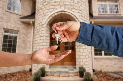 Handing Over The House Keys In Front Of New Home Stock Photo Image Of
