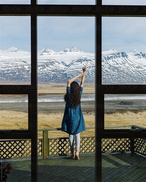 Woman Is Stretching On A Terrace Against A Beautiful Mountains By