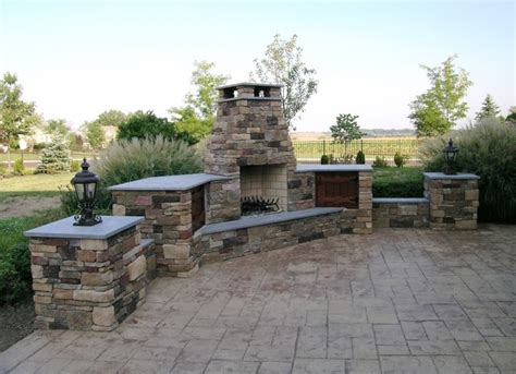 Custom Outdoor Fireplace With Wood Storage And Patio Lighting