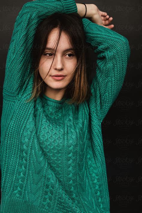 Portrait Of A Girl Wearing Green Knitted Sweater By Stocksy