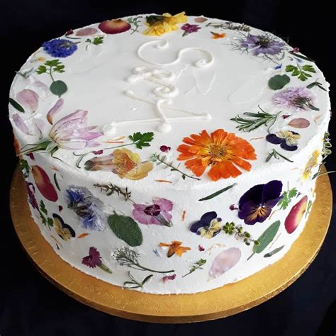 side view of the flower pressed edible flower wedding cake wildflower bakery wedding cakes