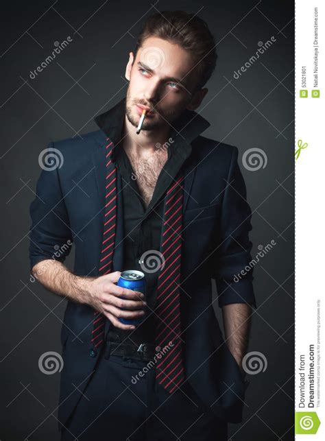 Man With A Cigarette And A Drink In A Tin Stock Image