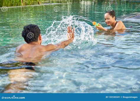 Playful Couple In Swimming Pool Stock Image Image Of Swimming Vacation 132245341