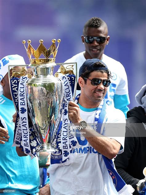 Diego Costa Of Chelsea Celebrates With The Premier League Trophy