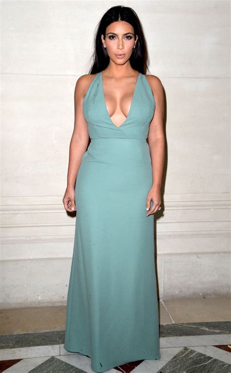 Kim Kardashian Flaunts Major Cleavage In Plunging Blue Dress At