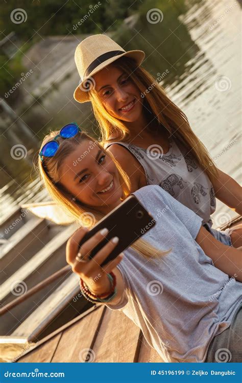 Two Girls Taking Selfie Near River Stock Image Image Of Relaxation Adult 45196199
