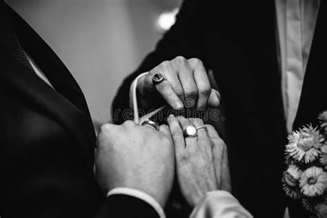Greyscale Close Up Of A Recently Married Couple Exchanging Wedding