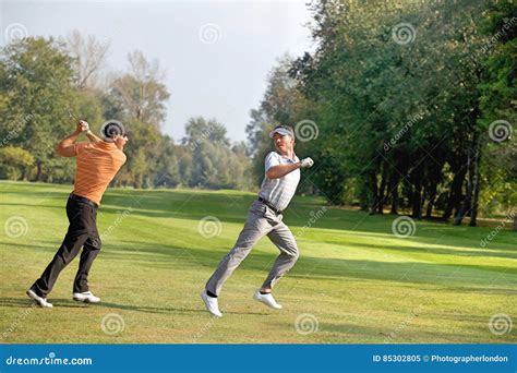 Friends Having Fun In Golf Course Stock Image Image Of Length Full