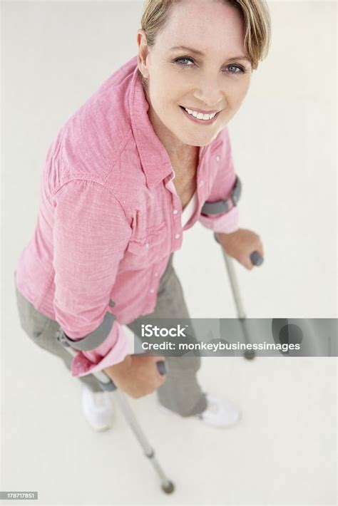 Woman Walking With Crutches Stock Photo Download Image Now Crutch