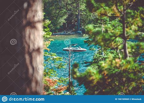 High Angle Shot Of A Boat Sailing In The Lake In The Forest Editorial