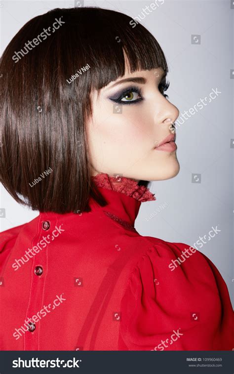Many women opt for short hairstyles during the summer to beat the heat, to make a statement, or because short hair can be much easier to handle and style. Beautiful Young Woman With Short Brown Hair In Red Vintage ...