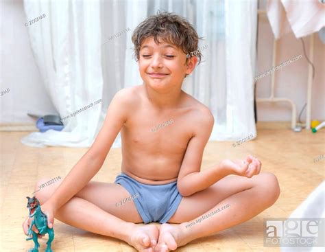 Boy Indoors Meditating Stock Photo Picture And Royalty Free Image