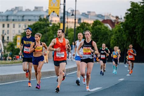 Group Male And Female Athlete Running Marathon White Nights Editorial