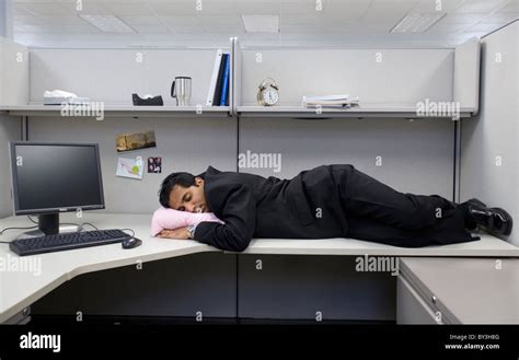 A Man Sleeps On His Desk At Work Stock Photo Alamy