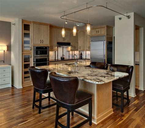 In the modern condo pictured, the clean profile and smooth texture of gray slab door cabinets optimize visual space. Condo Kitchen Designs for Modern Contemporary: Brown Leather Kitchen Chair Brwon Wooden K ...