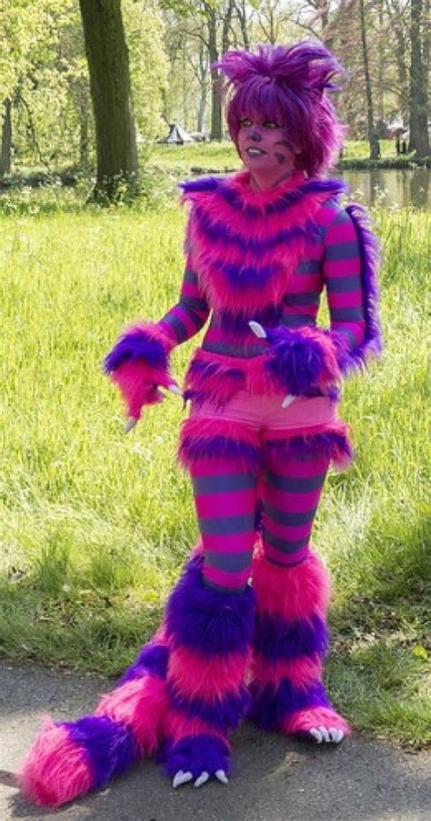 Use purple duct tape to add stripes to the dress and tights (be sure you've already put them on; Cheshire Cat Costume | Cheshire cat costume, Cat costume kids, Cat costume diy