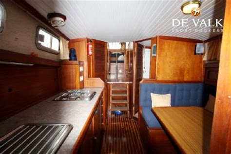 Classic teak interior, wheelhouse, saloon two cabins, 3 (+2) berths. FISHER 37 sailing yacht for sale | De Valk Yacht broker