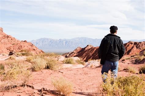 Premium Photo Man Walking In Desert Landscape