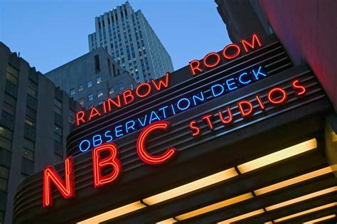 Neon Lights Of Nbc Studios And Rainbow Room At Rockefeller Center New