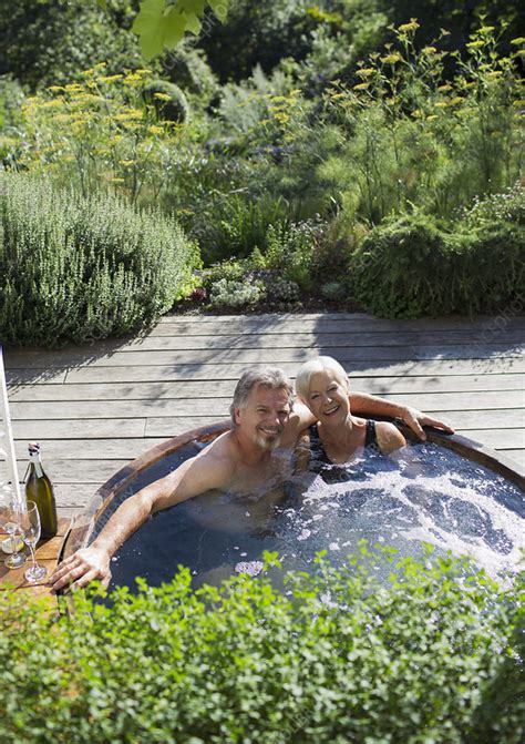You could even dig a hole in the ground to build a temporary hot tub right in the sand (or in the snow) by securing the hammock within the hole. Senior couple relaxing in hot tub on patio - Stock Image ...